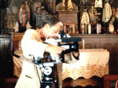 Harold Joe Waldrum videoing the interior of a church in northern New Mexico