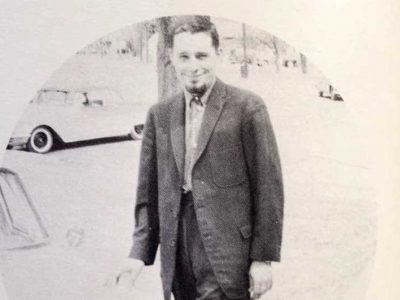 Harold Joe Waldrum and his light blue Peugot outside Lakin High School in the 1960s